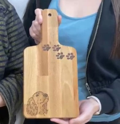 image of dog burnt into chopping board using the art of pyrography