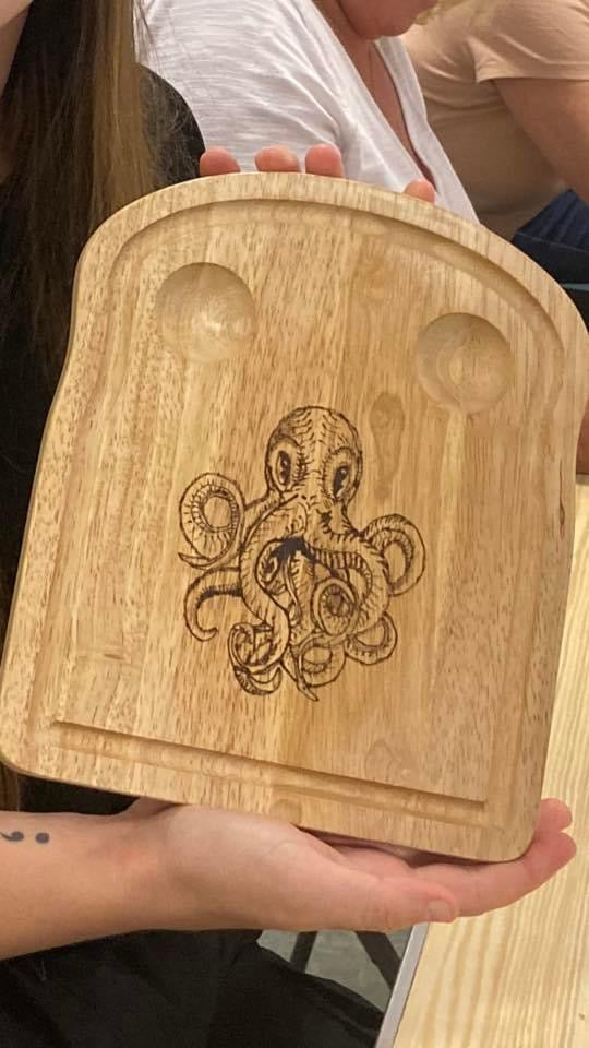 octopus design burnt onto an egg board 