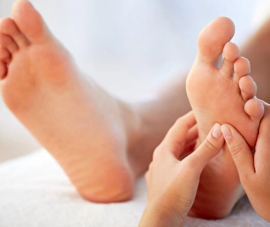 reflexology treatment, hands and feet